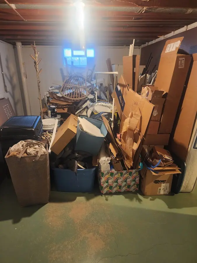 Roll-off dumpster container at job site for 2 Yard Dumpster Rental in Denison